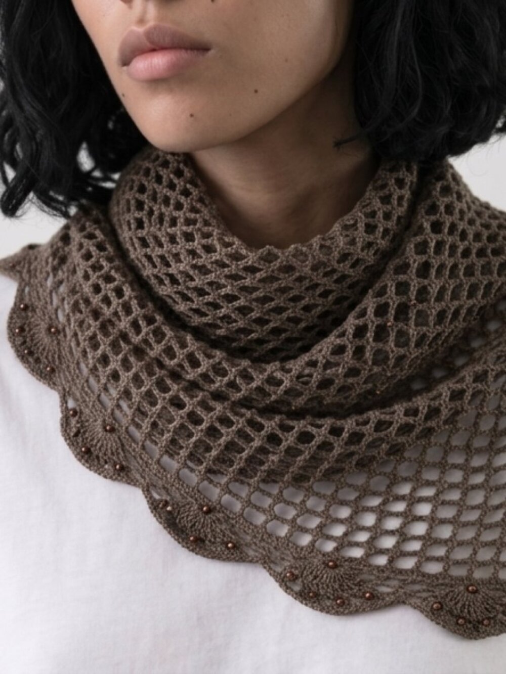 Beautiful handmade-style crochet triangle shawl featuring a delicate open mesh